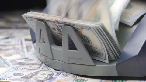 Counter money machine counts 100 dollar bills or USD banknotes. Currency Stock Footage 148560447