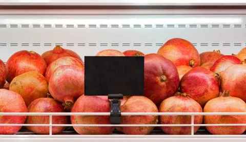 Counter with pomegranates Stock Photos