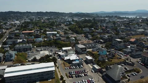 Counterclockwise drone shot of the small coastal town of Newport, Oregon Stock Footage 197448939