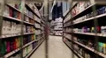 Counters with goods in a supermarket. View from the moving shopping trolley HD Footage
