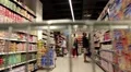 Counters with goods in a supermarket. View from the moving shopping trolley HD Footage