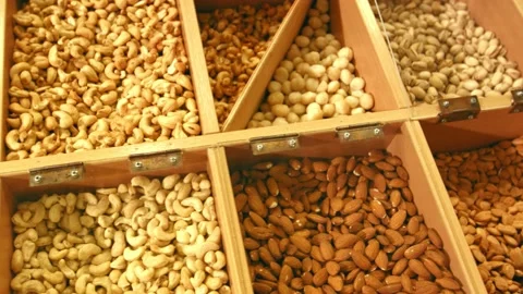 Counters with many varieties of nuts in a supermarket Stock Footage 143757797