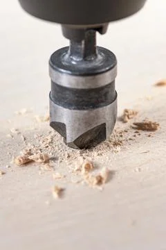 Countersink for deepening the self-tapping screw. A countersink drill makes a Stock Photos