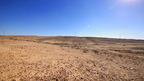 Counterwise panoramic of road traffic over desert Stock Footage 96334010