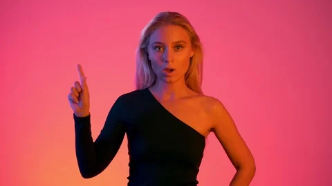 Counting from 1 to 3. Young blonde woman shows one, two, three fingers with her Stock Footage 116893752