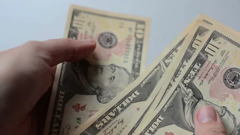 Counting 10 dollar banknotes in hands Stock Footage 105220937
