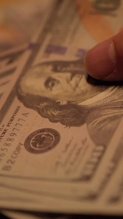 Counting 100 dollar bills by hand close-up 動画素材 345089469