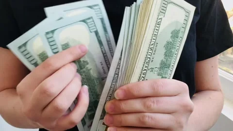 Counting 100 dollar bills, a stack of dollars Stock Footage 304634734