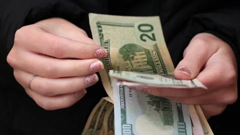 Counting and showing US Dollar money. Counting USD banknotes 3 Stock Footage 172099171