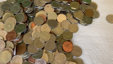 Counting and Sorting a Pile of Jordanian Coins Stock Footage 345305831