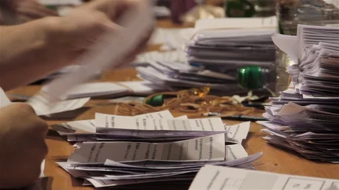 Counting ballot papers wider view Stock Footage 102351242