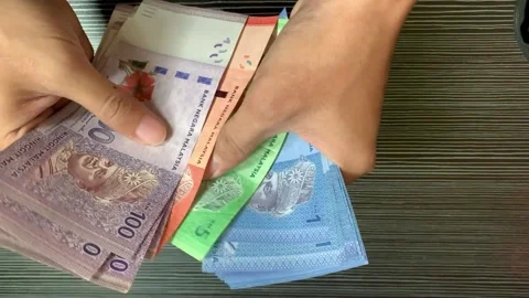 Counting banknotes of Malaysian Ringgit Stock Footage 263783877