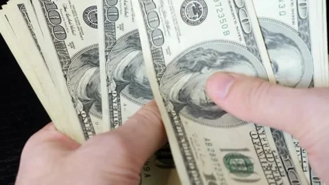 Counting a bundle of dollar paper money. The concept of earnings and busine.. Stock Footage 266473291