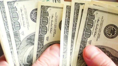 Counting a bundle of dollar paper money. The concept of earnings and business Stock-Footage 336262180