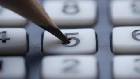 Counting on calculator extreme closeup Video stock 86230673