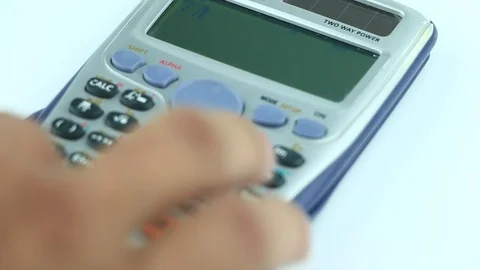 Counting on calculator. Finger presses the button calculator. Closeup. Stock Footage 85564057