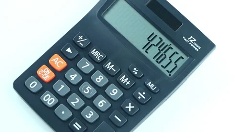 Counting on calculator. Finger presses the button calculator. Closeup. Stock Footage 87260363