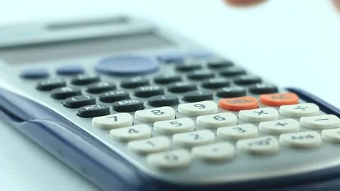 Counting on calculator. Finger presses the button calculator. Closeup. Stock Footage 87260409