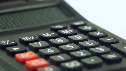 Counting on calculator. Finger presses the button calculator. Closeup. Stock Footage 88705925