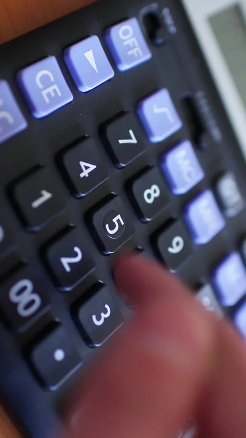 Counting on calculator. Finger presses the button calculator. Closeup. Video stock 270066793