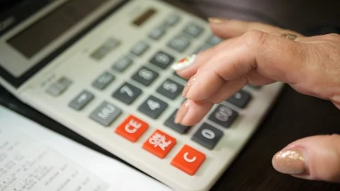 Counting on calculator. Stock Footage 119172623