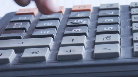 Counting on calculator. Macro. Finger presses the button calculator Stock Footage 63973430