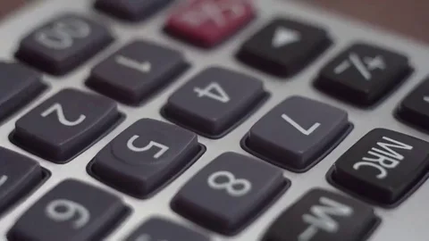 Counting on calculator. Macro. Finger presses the button calculator Stock Footage 69211334