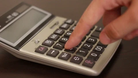 Counting on calculator Macro. Finger presses the button calculator. Closeup. Stock Footage 108920128