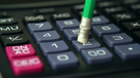 Counting on the calculator with pencil Stock Footage 87185795
