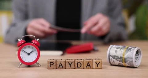 Counting cash and checking time reveals the excitement of payday celebrations in Stock Footage 319646871