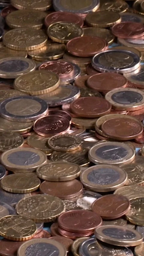 Counting coins on a flat surface in a cluttered space filled with various Video stock 324539210