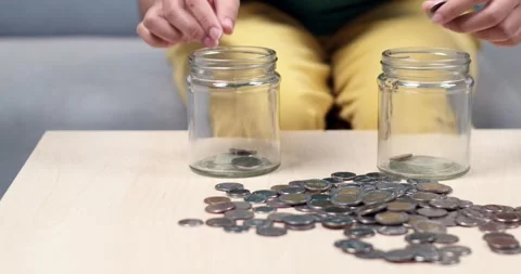 Counting coins personal finance activity home educational content indoor Stock Footage 335219093