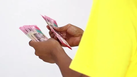 Counting Currency Notes Against Plain Background Stock Footage 307048249