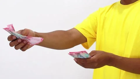 Counting Currency Notes Against Plain Background Stock Footage 307051375