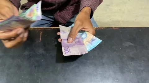 Counting Currency Notes on a Dark Surface Stock Footage 289388671