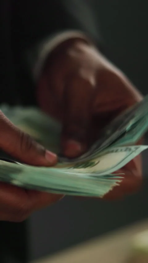 Counting, dollar and payment with cash and hands for money laundering, crime and Stock Footage 333690729