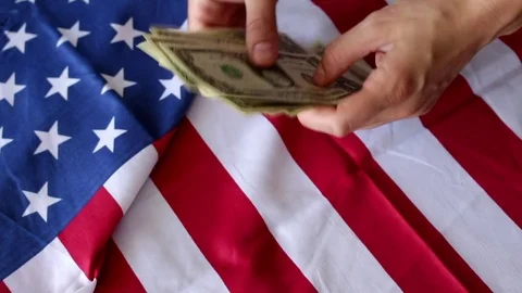Counting dollars with flag Stock Footage 76718737