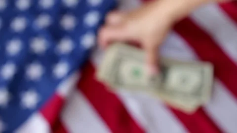 Counting dollars with flag Video stock 76718810