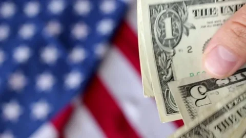 Counting dollars with flag Stock Footage 76718831