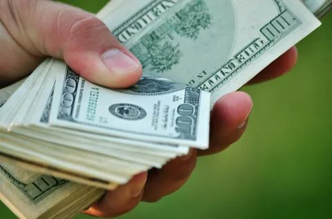 Counting dollars Stock Photos