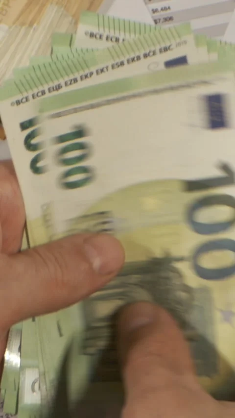 Counting euro banknotes displayed on a table Stock Footage 337229003