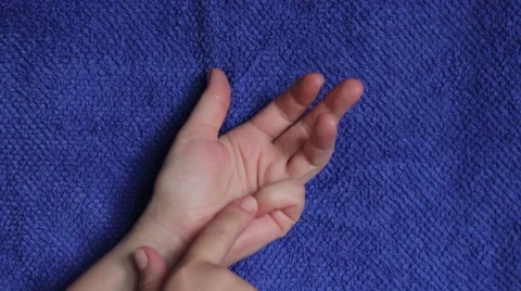 Counting on fingers on a blue background Stock Footage 65372726