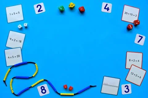 Counting flatlay on a blue background. Stock Photos