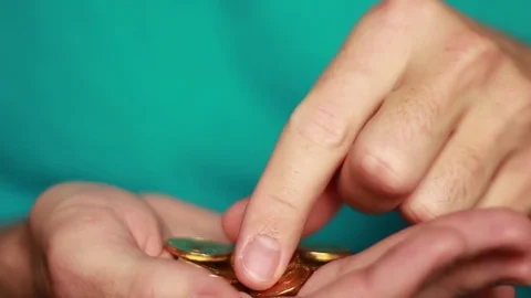 Counting golden coins in hands 스톡 동영상 73506471