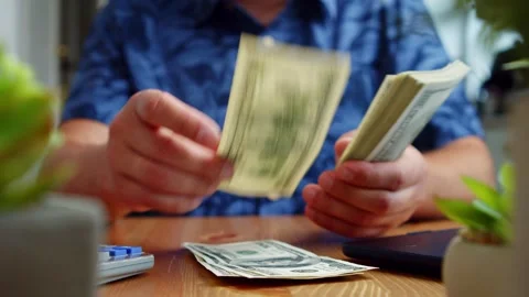 Counting Hundred Dollar Bills At Kitchen Table In Natural Daylight Stock Footage 312526451