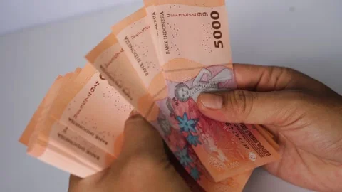 Counting Indonesian Rupiah, Five Thousand Banknotes Transaction and Finance Video stock 305262944