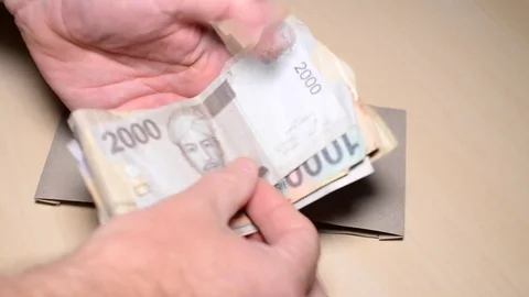 Counting Indonesian Rupiah Stock Footage 78317830