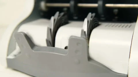 The counting machine counts many bills for one hundred American dollars of a new Stock-Footage 102621129