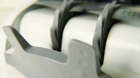 The counting machine counts many bills for one hundred American dollars of a new Stock-Footage 103479913