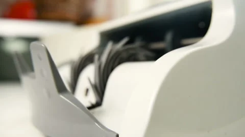 The counting machine counts many bills for one hundred American dollars of a new Stock-Footage 104412754